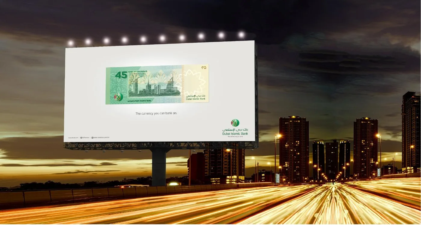 DIB “The currency you can bank on” billboard at night